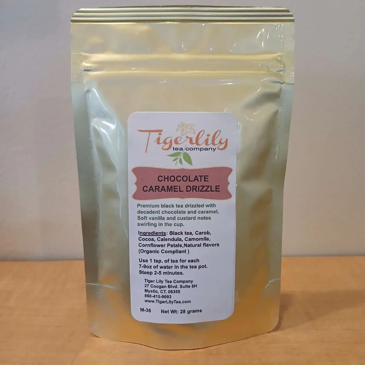 Tea package with Tigerlily Tea Company label on a wooden surface