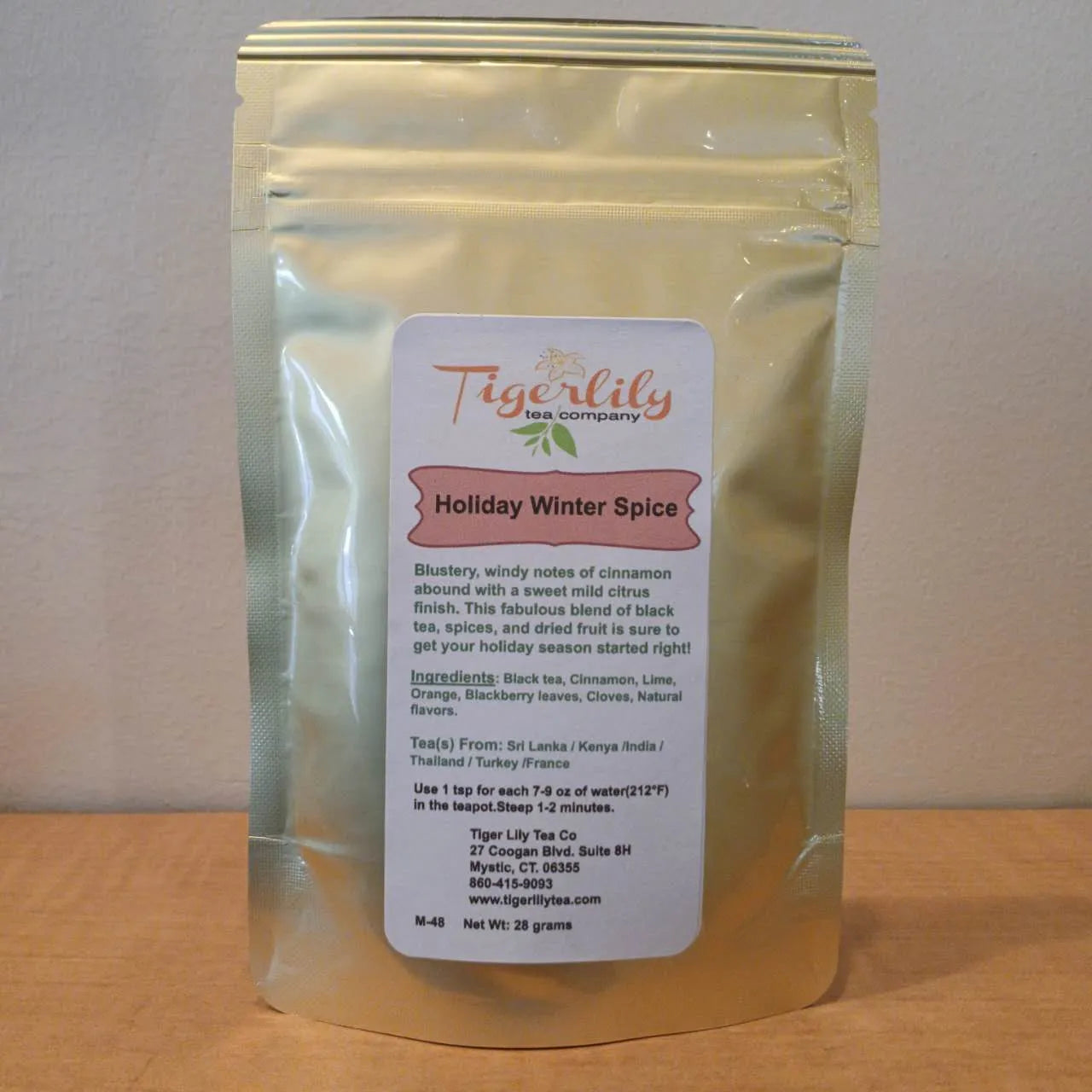 Tea package with Tigerlily Tea Company label on a wooden surface