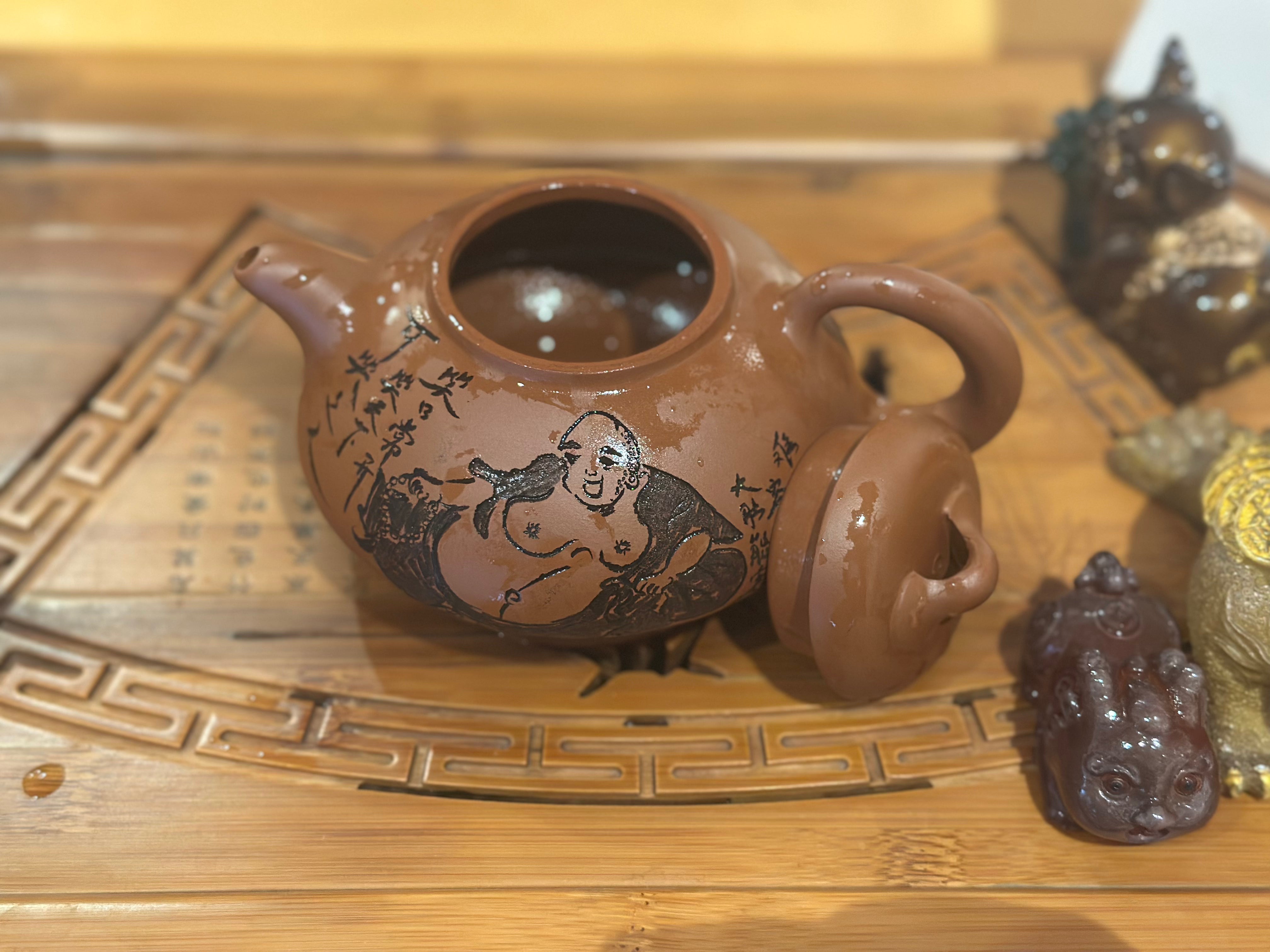 Fine Yixing Zhuni teapot with Laughing Buddha engraving| TigerlilyTea