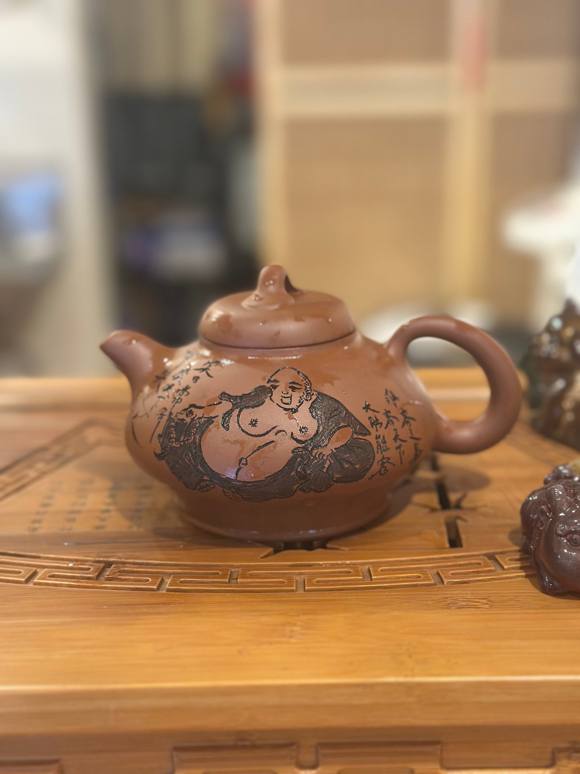 Fine Yixing Zhuni teapot with Laughing Buddha engraving| TigerlilyTea