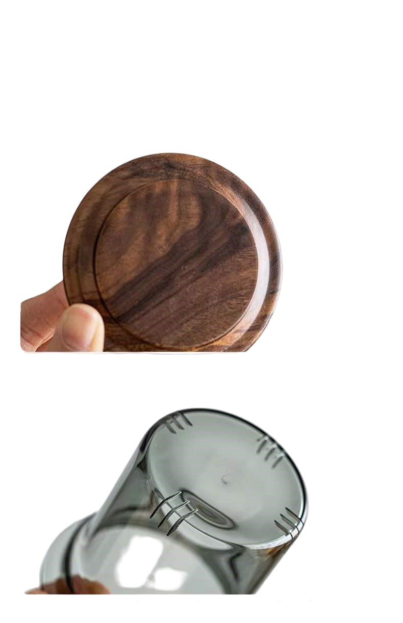 Wooden lid held above a metal container on a white background