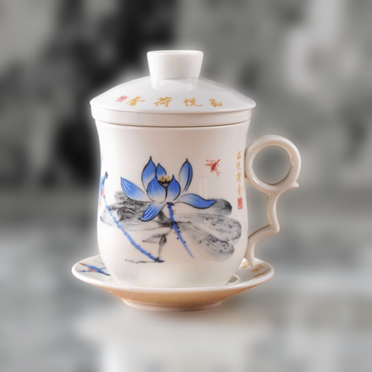 Ceramic mug with lid featuring a blue lotus design on a gray background