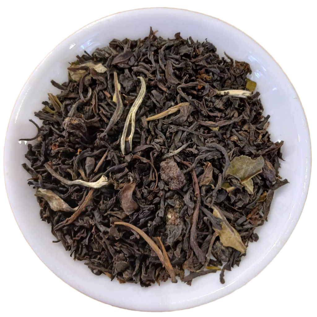 Dry black tea leaves in a white bowl