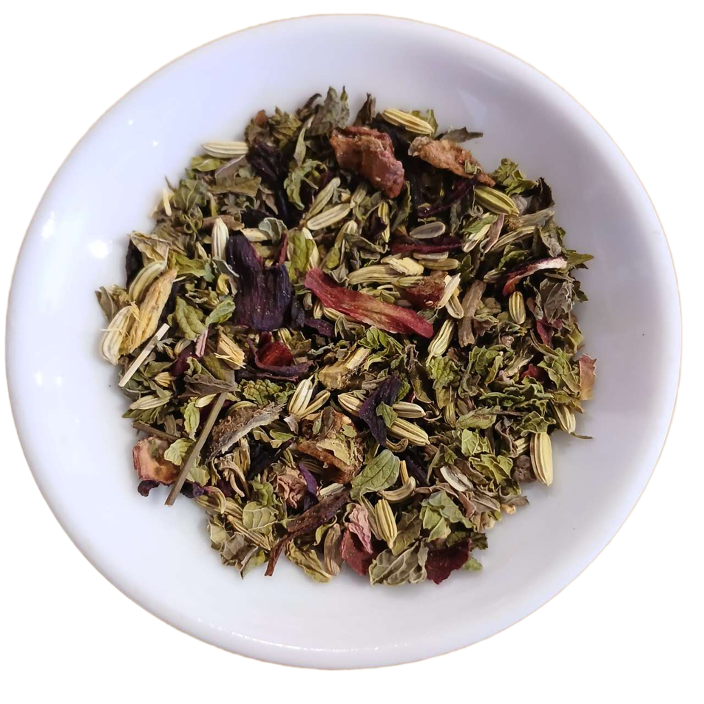 Assorted dried herbs and leaves in a white bowl on a white background