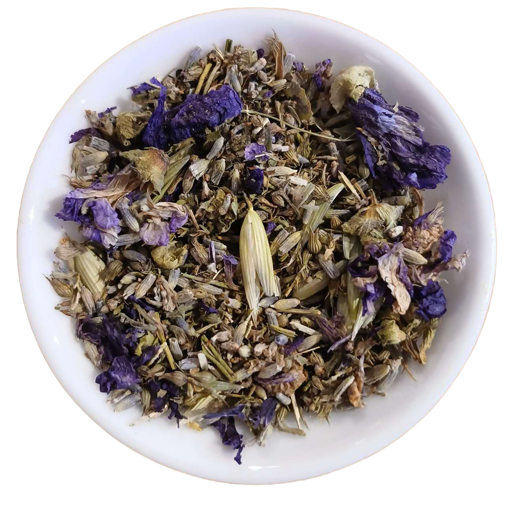 Herbal tea mix with purple flowers and green leaves in a white bowl