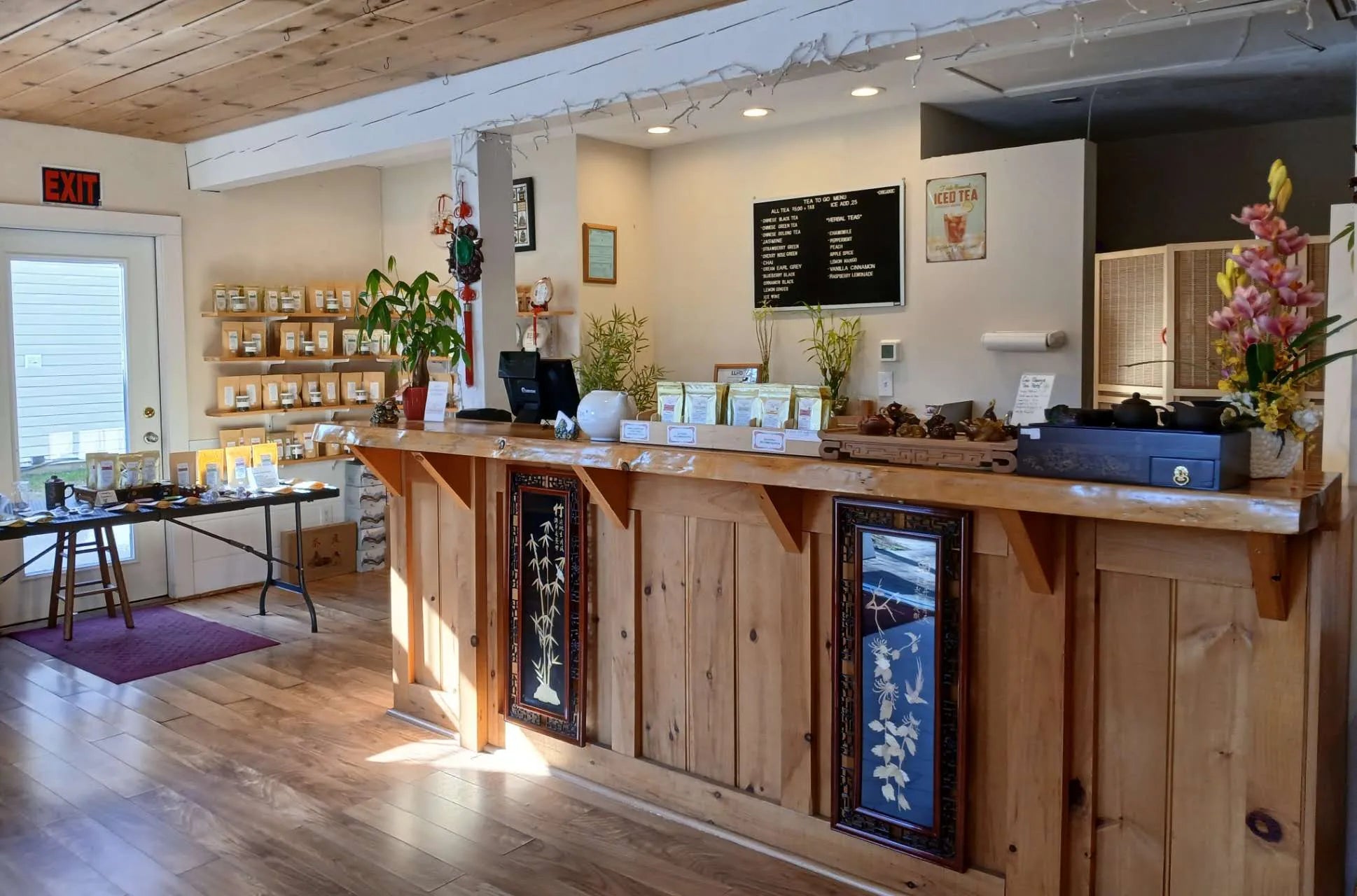 Wooden reception desk in a welcoming interior setting with decor elements.